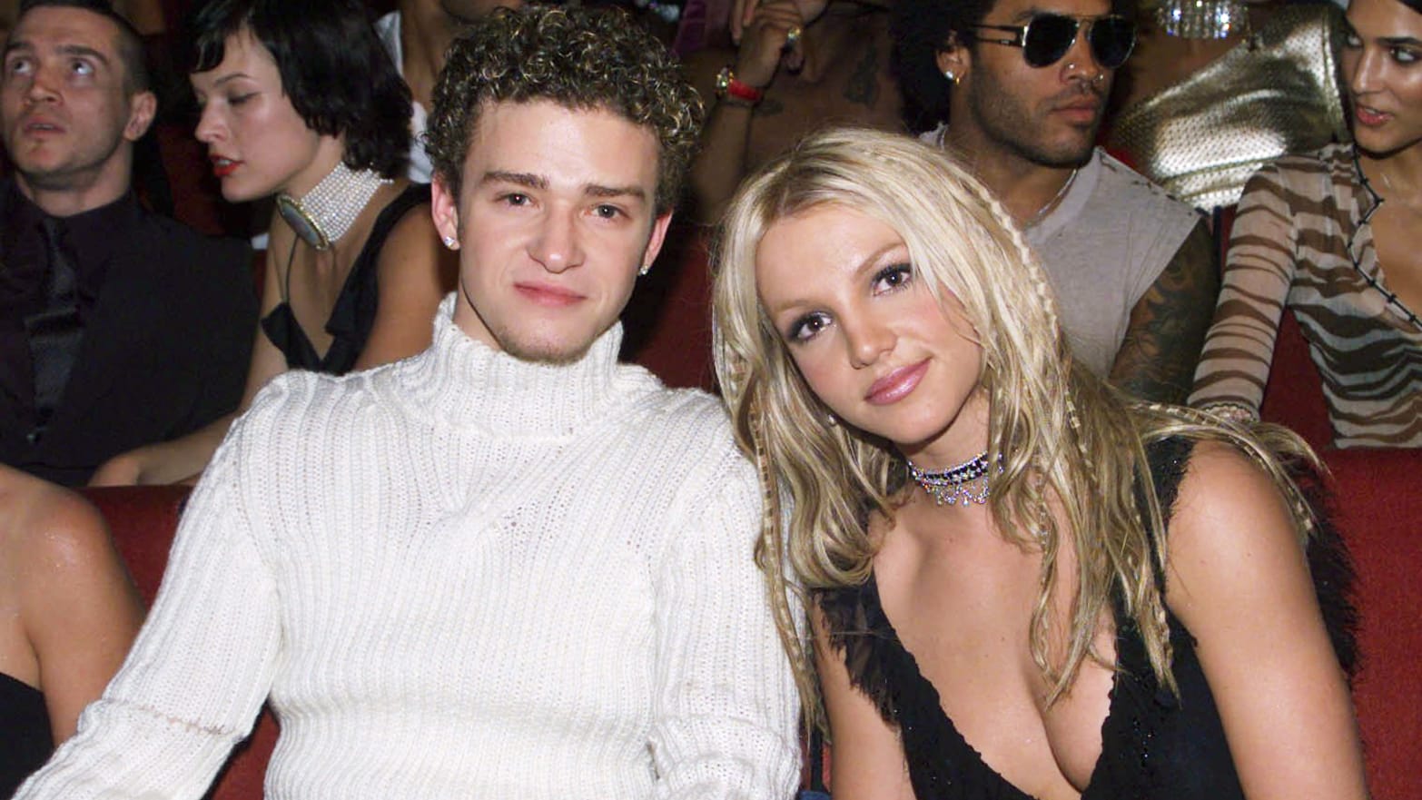 Justin Timberlake and Britney Spears smile in their seats at the 2000 MTV Video Music Awards