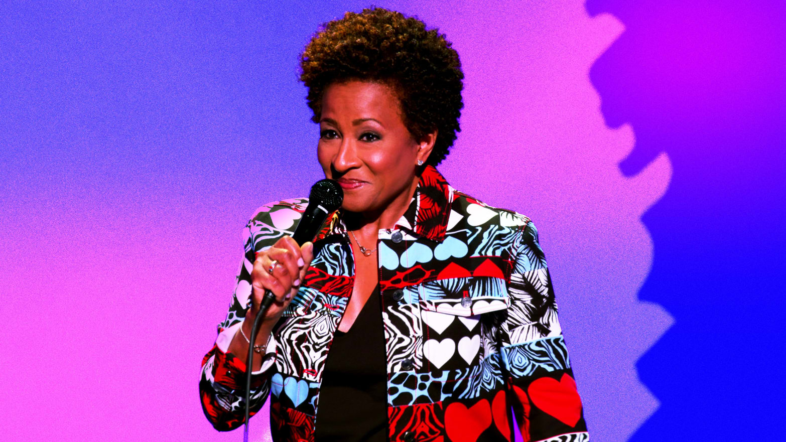 Photo illustration of Wanda Sykes performing standup on a purple and blue background