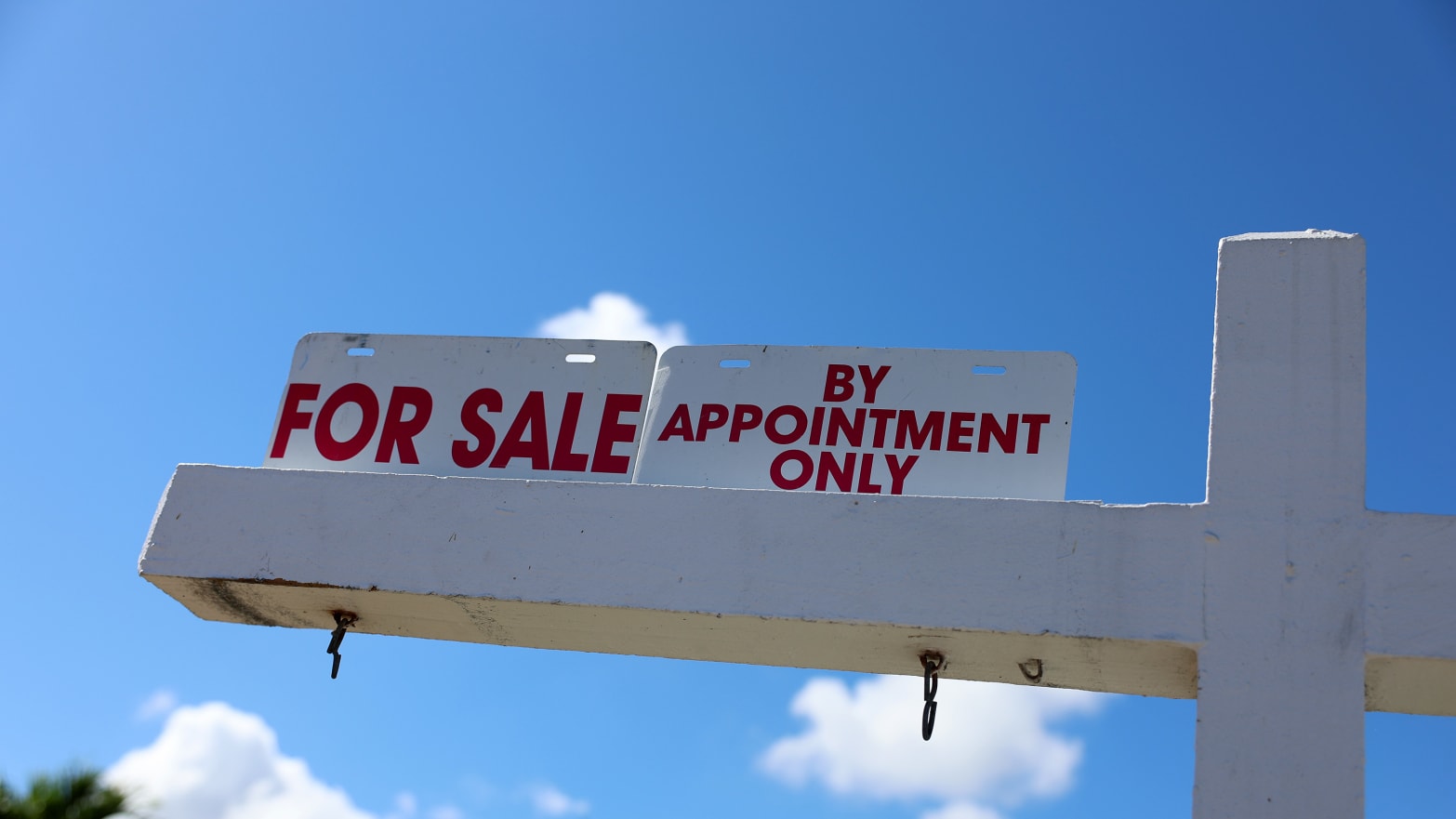 A For Sale sign displayed in front of a home on February 22, 2023 in Miami, Florida. 