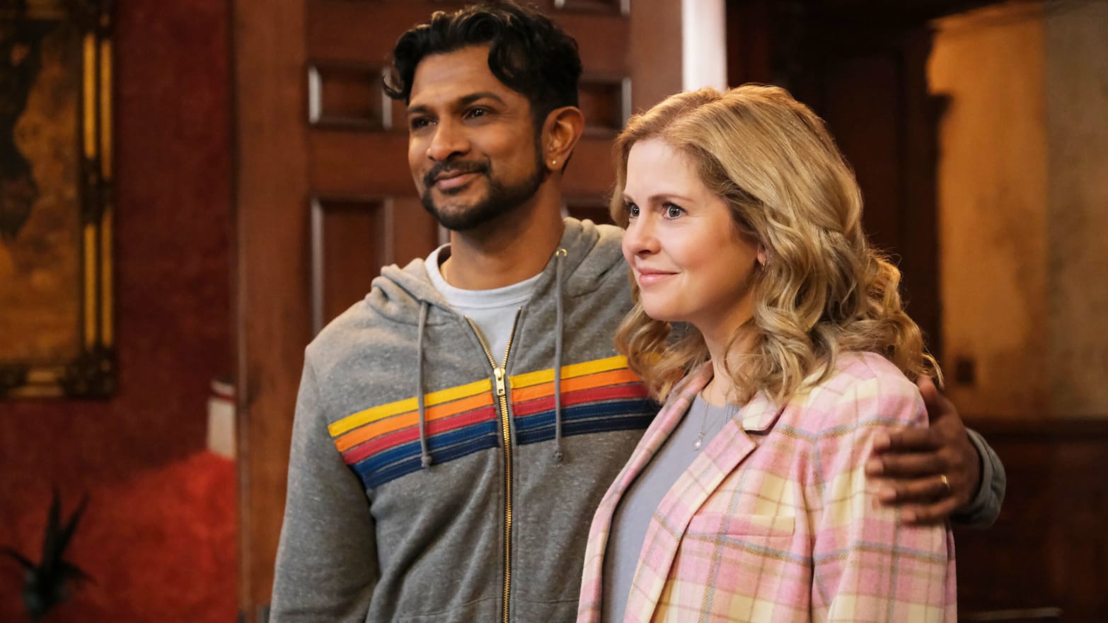 A photo including Utkarsh Ambudkar as Jay and Rose McIver as Samantha in the series Ghosts on CBS