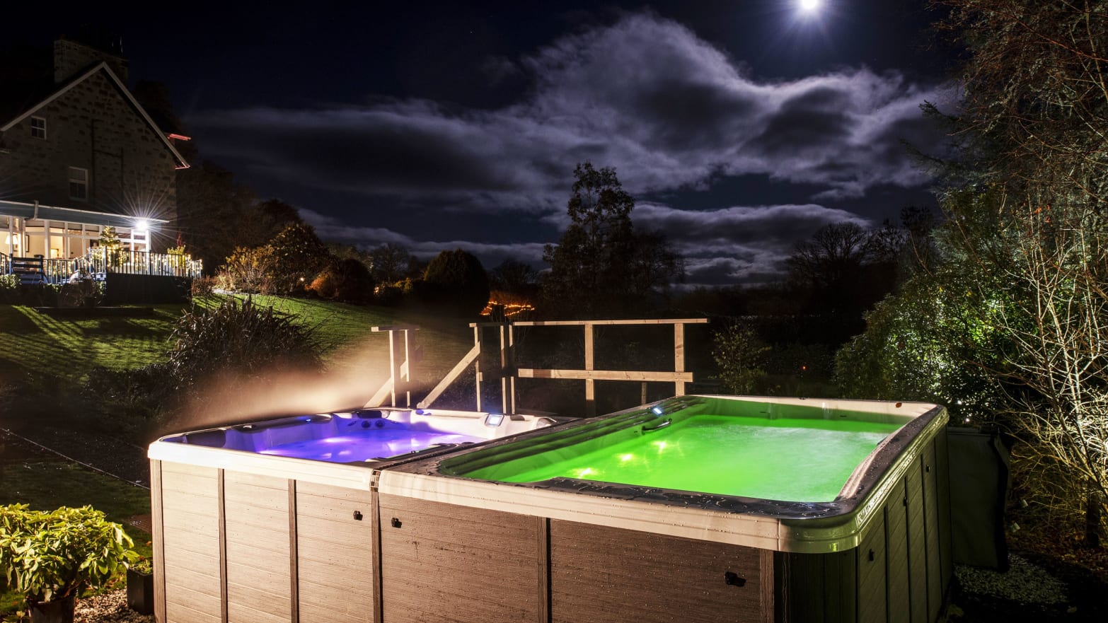 A photo including a hot tub and dark skies 