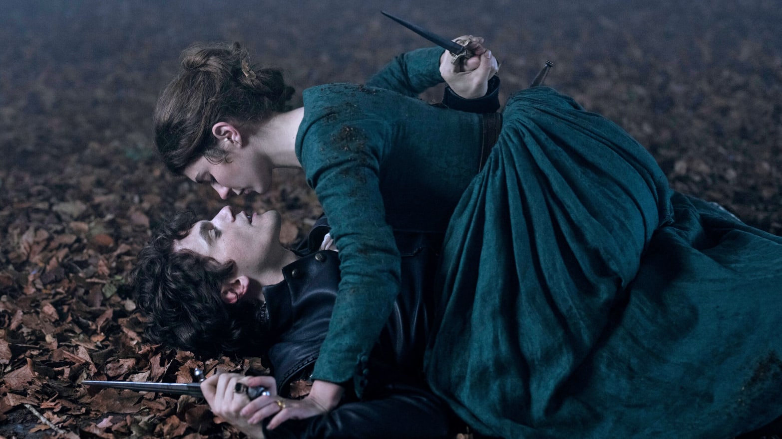 Emily Bader and Edward Bluemel on top of each other on the ground in ‘My Lady Jane’