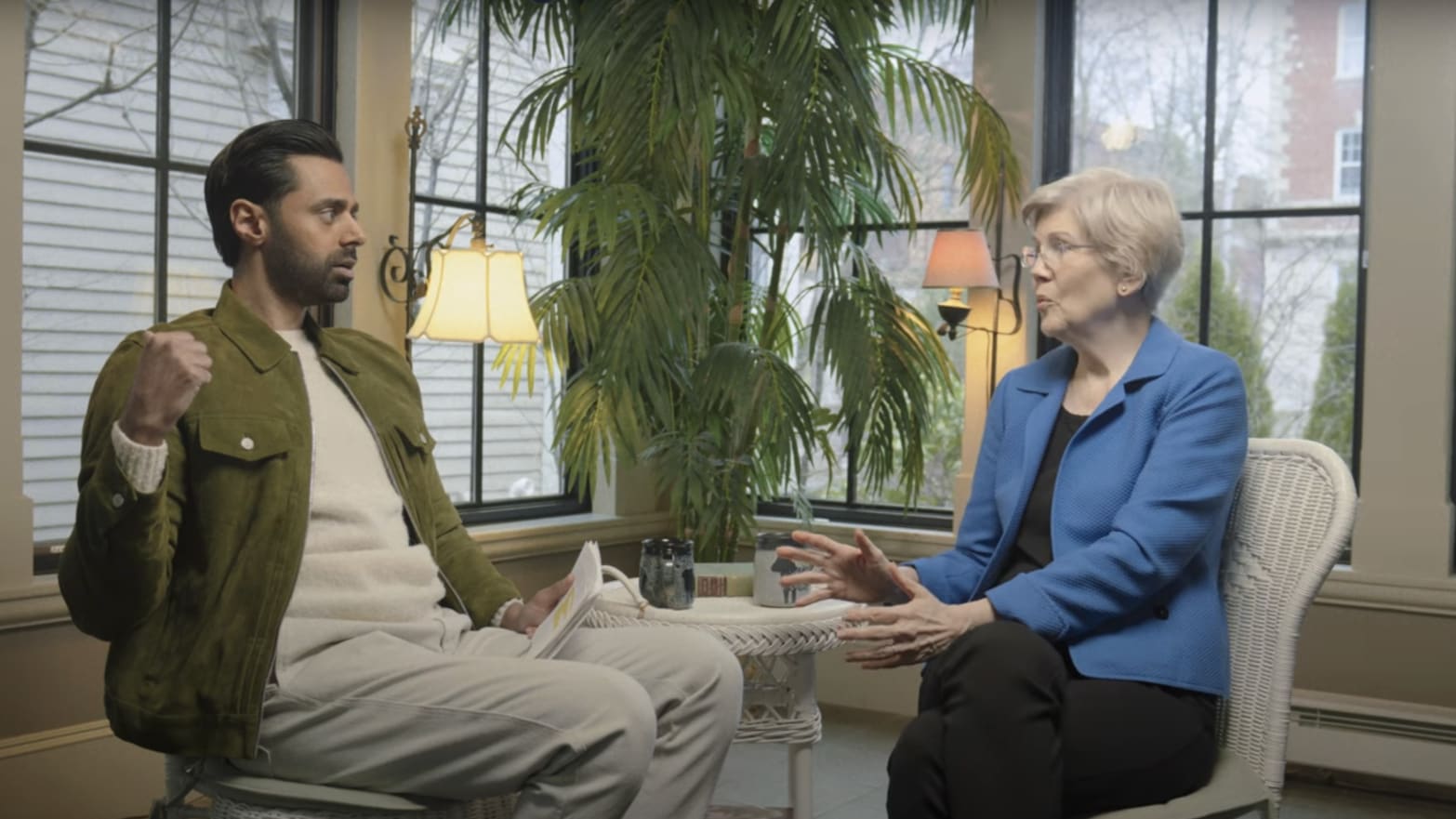 A photo of Hasan Minhaj and Elizabeth Warren