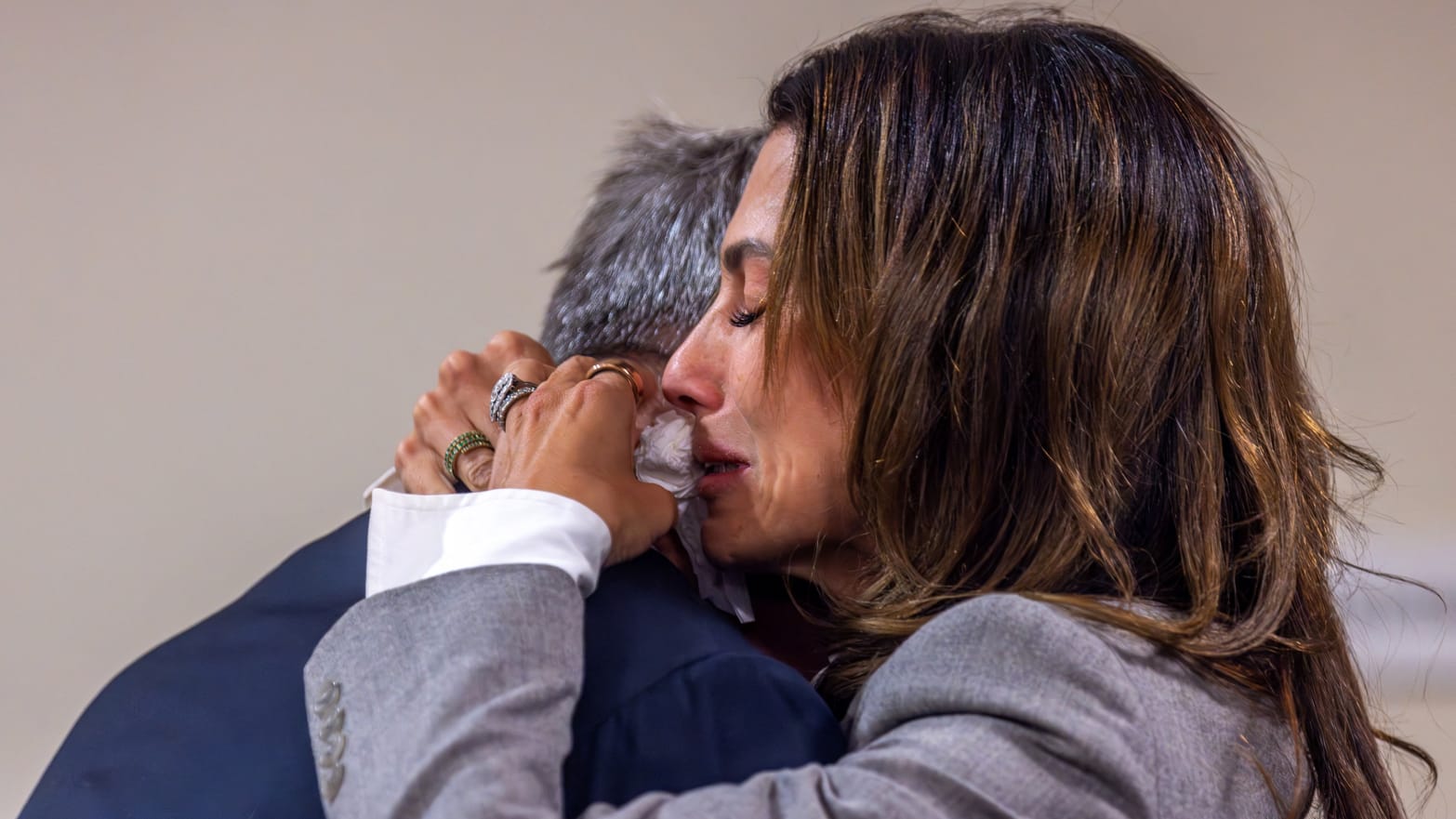 Actor Alec Baldwin and his wife, Hilaria, hug following the dismissal