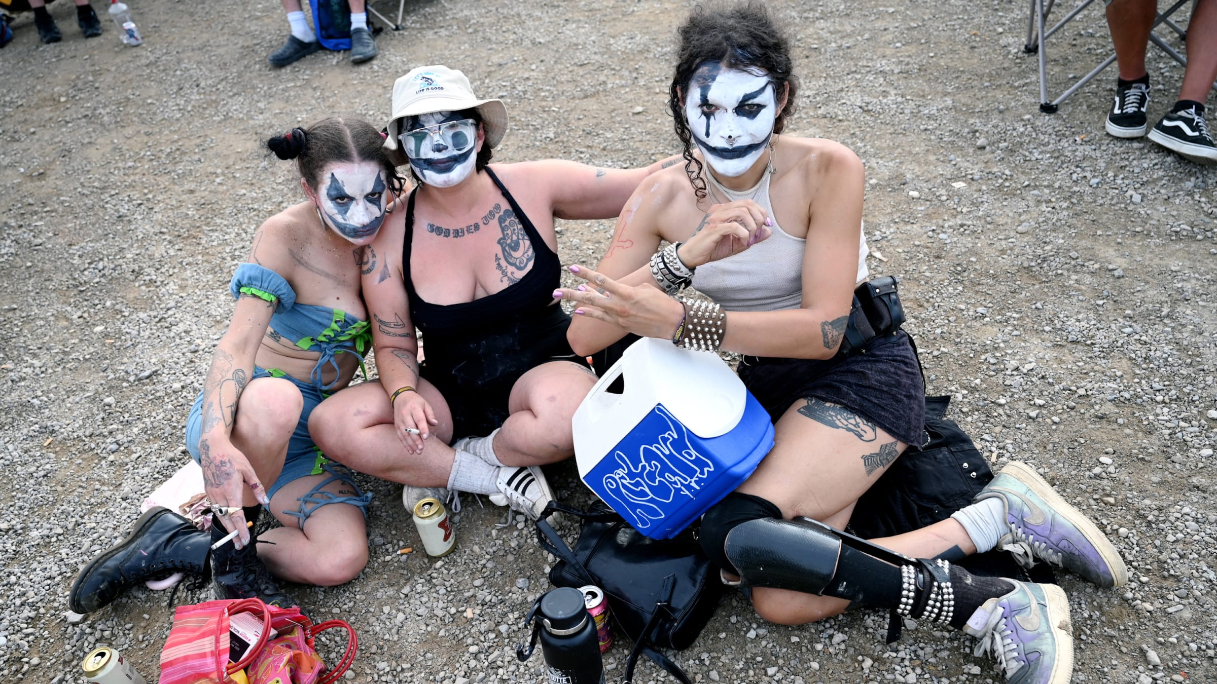A group of fans pose together at the 2023 Gathering of the Juggalos