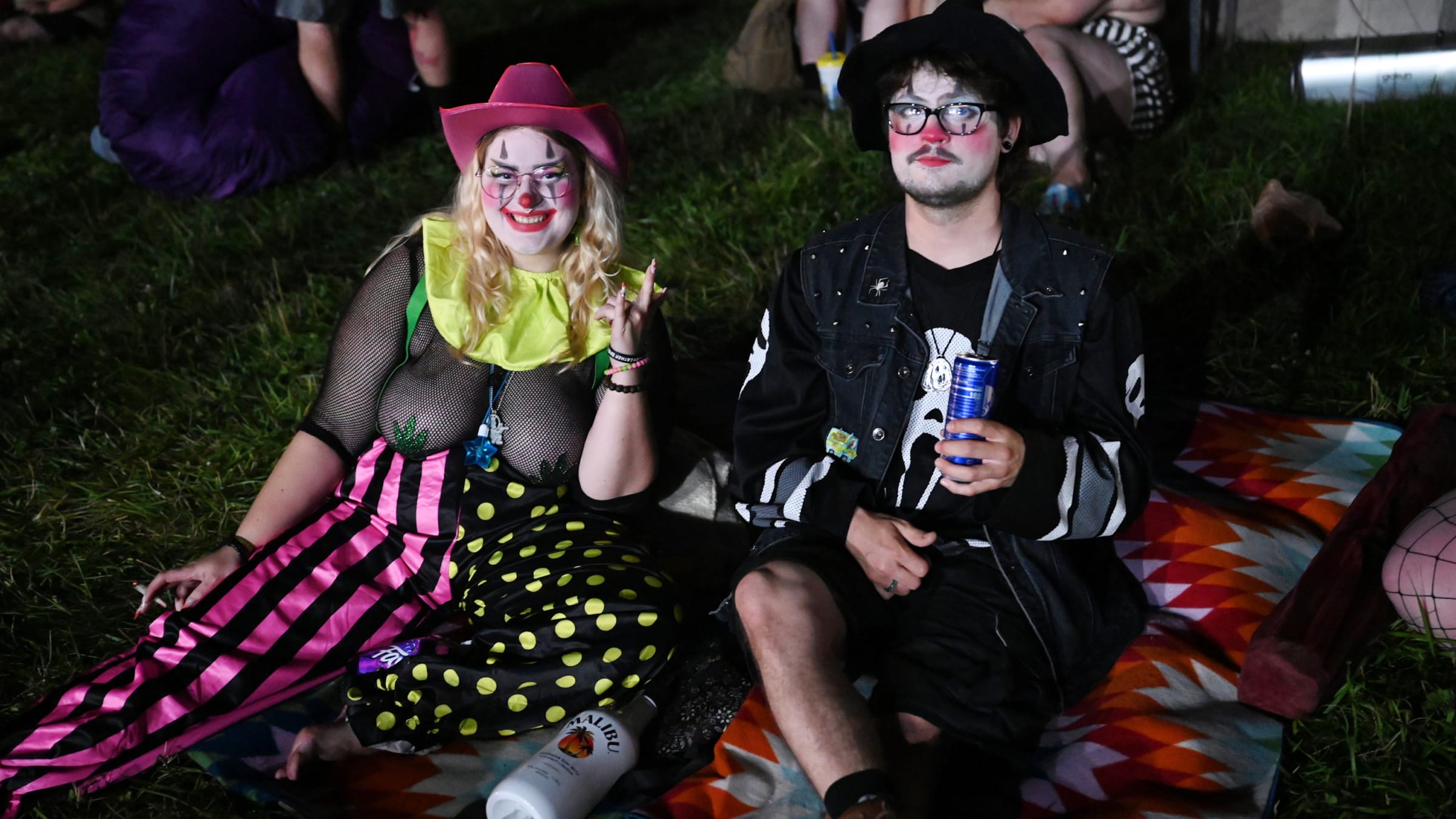 Two fans pose together at the 2023 Gathering of the Juggalos