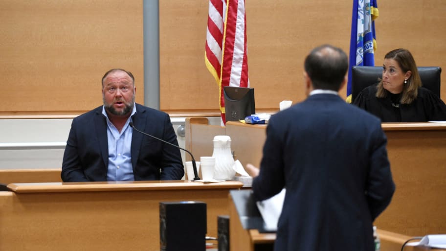 Alex Jones on the witness stand during his 2022 defamation trial.