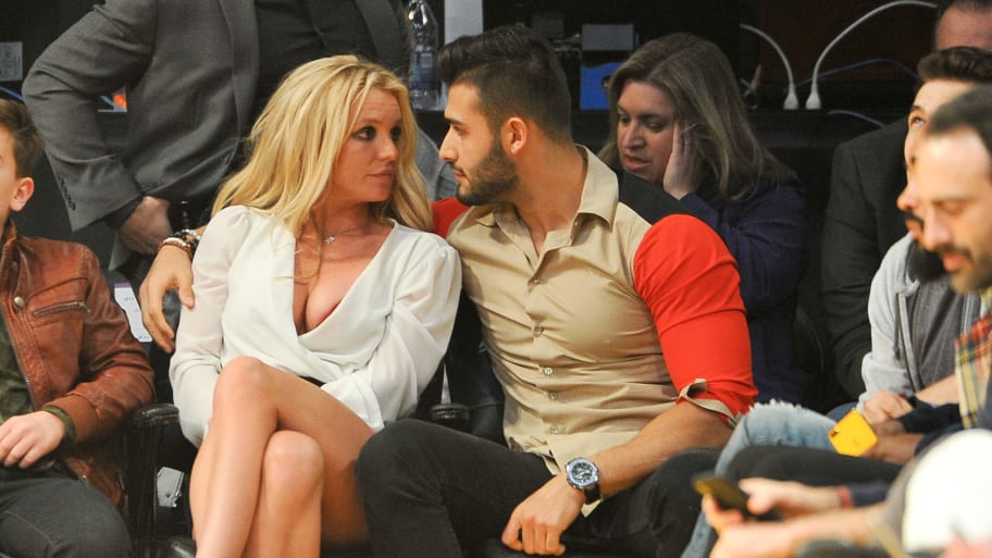 Britney Spears and Sam Asghari attend a basketball game between the Los Angeles Lakers and the Golden State Warriors at Staples Center on November 29, 2017.