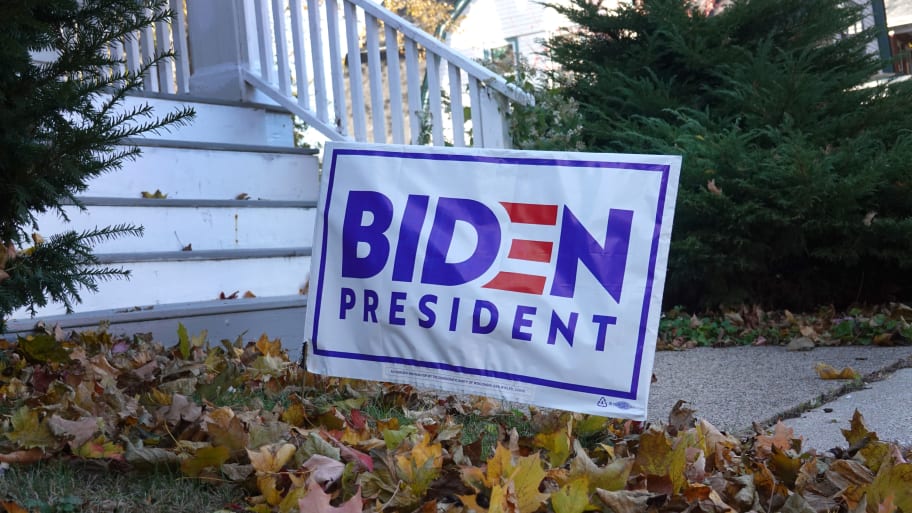 A photo of a Joe Biden yard sign in front of a house.