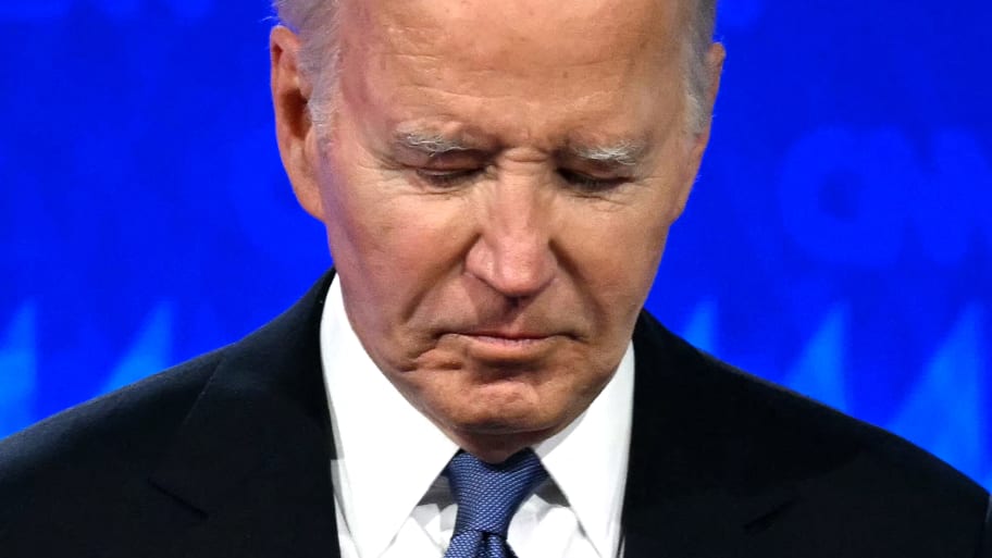 US President Joe Biden looks down as he participates in the first presidential debate of the 2024 elections