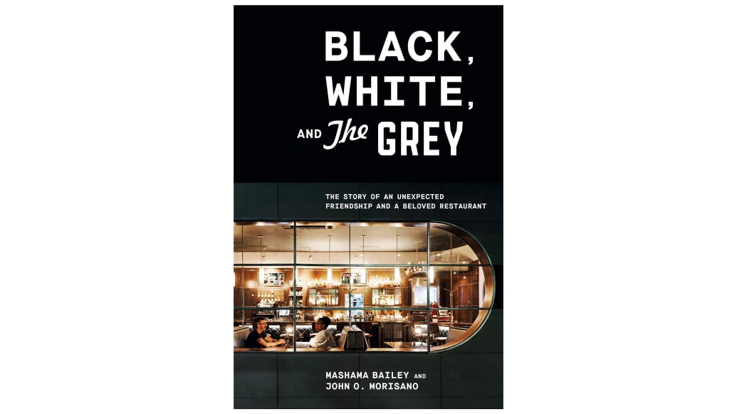 A photograph of the book cover Black, White and The Grey.