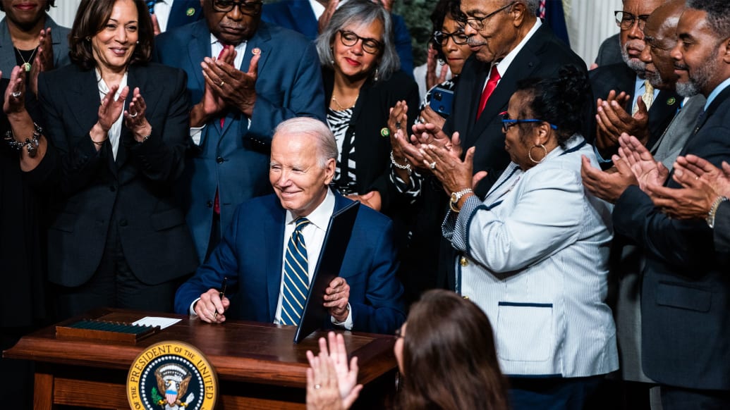 A photo including U.S President Joe Biden signs a proclamation to establish the Emmett Till and Mamie Till-Mobley National Monument in Illinois and Mississipp