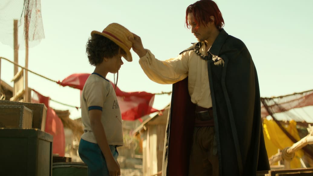 Colton Osorio as Young Luffy, Peter Gadiot as Shanks in One Piece.