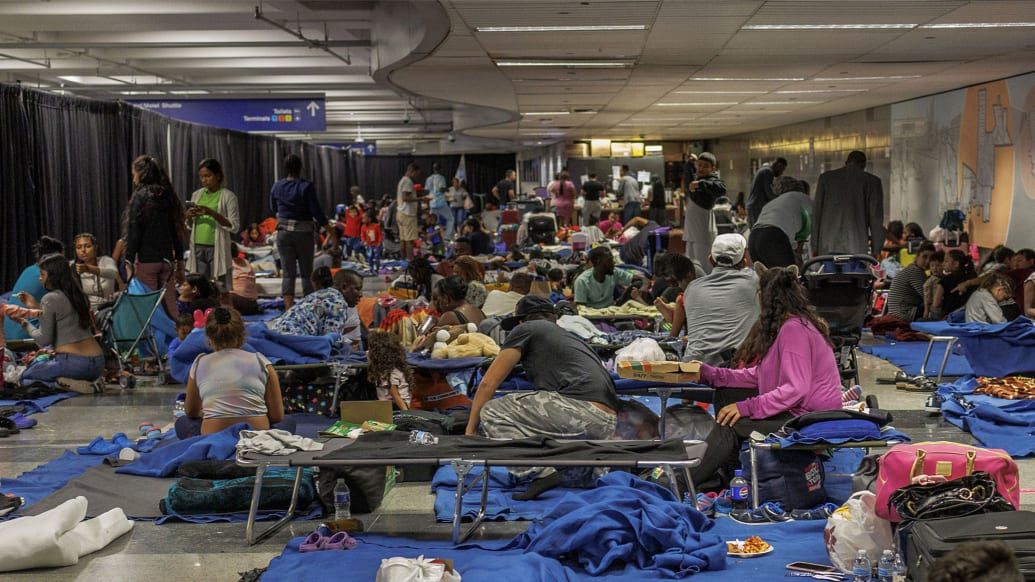 Recently arrived migrants in a makeshift shelter operated by the city of Chicago at O'Hare International Airport.