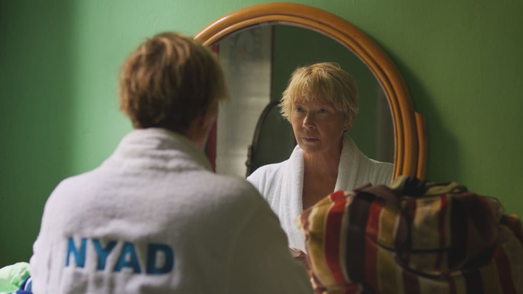 A photo including a film still of Annette Bening as Diana Nyad in the film NYAD on Netflix