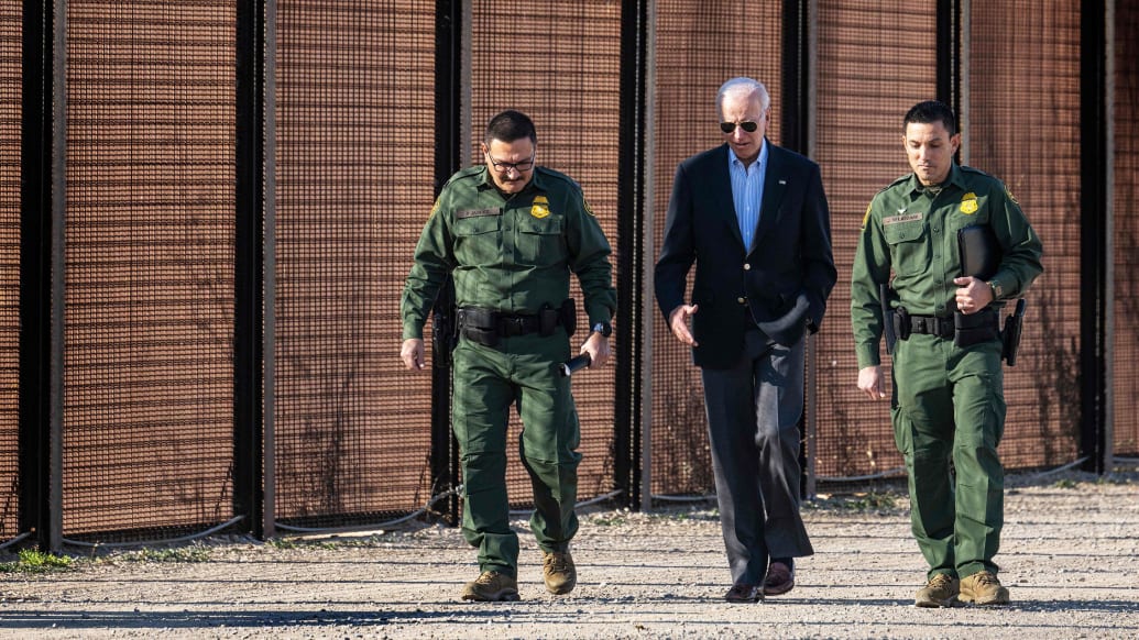 A photo including U.S. President Joe Biden with US Customs and Border Protection officers