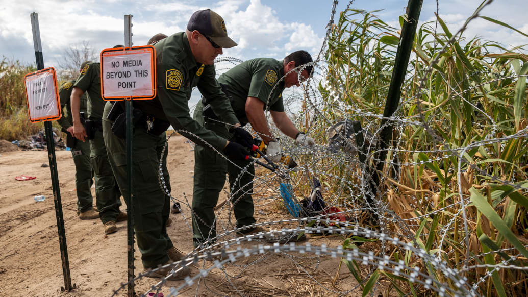 A photo including U.S. Border Patrol agents 