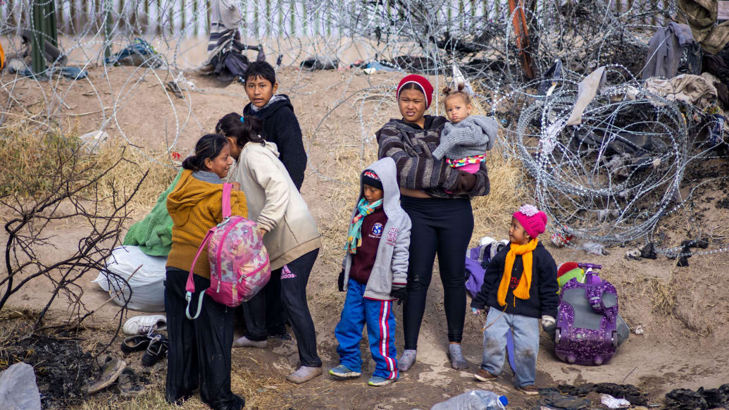 A photo including Migrants at the U.S. Border