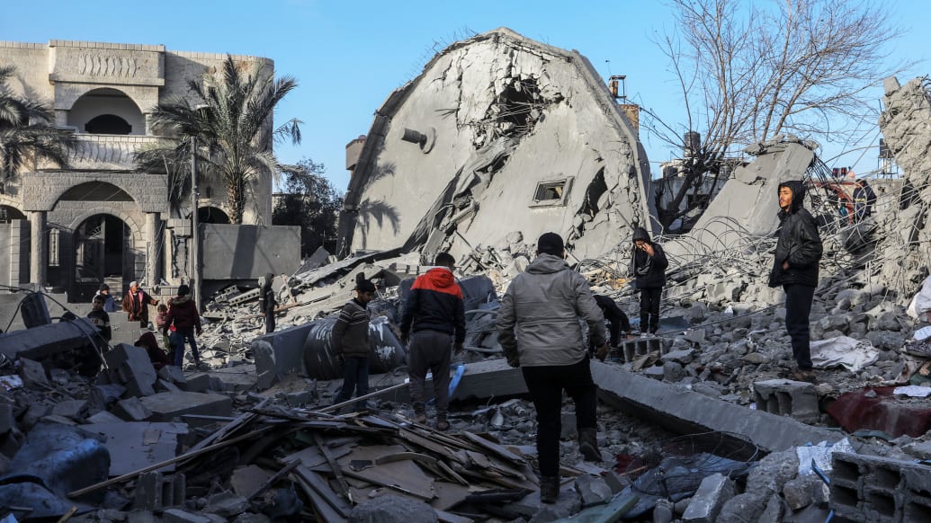 A photo including several buildings collapsed or heavily damaged after an Israeli bombing.