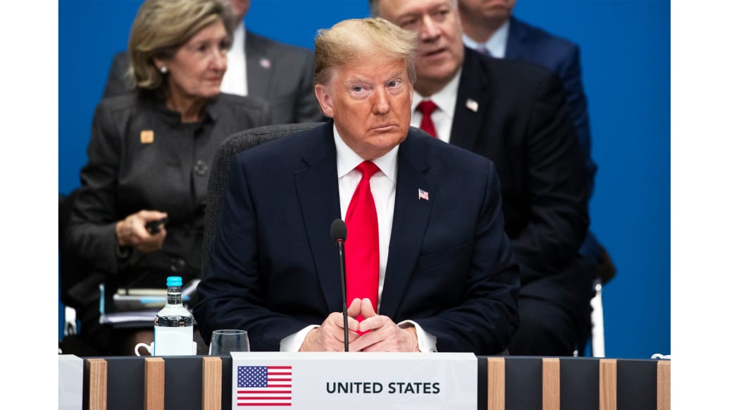 A photo including former U.S President Donald Trump at a NATO summit at the Grove Hotel
