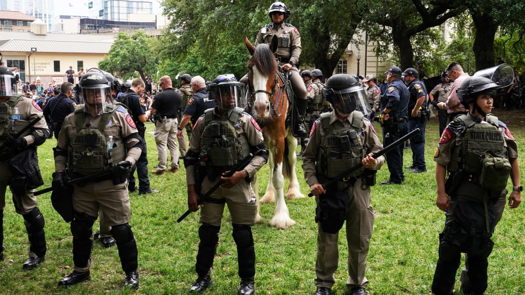 A photo including Texas State Troopers during a pro-Palestinian protest on the campus of the University of Texas in Austin