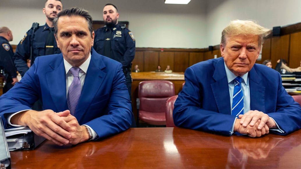 A photo including U.S. President Donald Trump and his attorney Todd Blanche 
