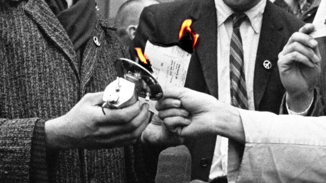 A photo illustration showing the burning of pacifists draft cards in the USA during a protest of the Vietnam War.