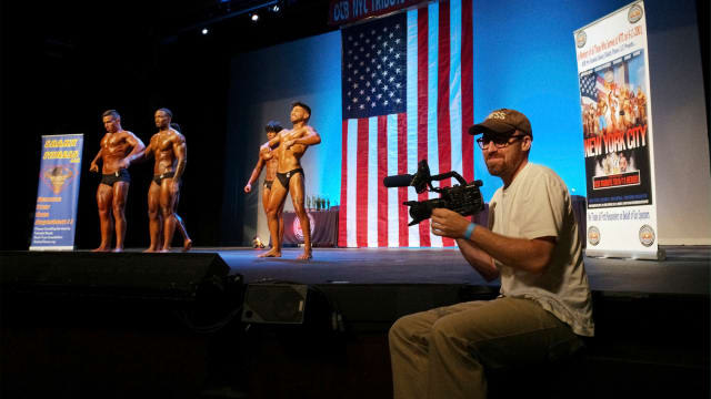 John Wilson at a 9/11-themed body building competition.