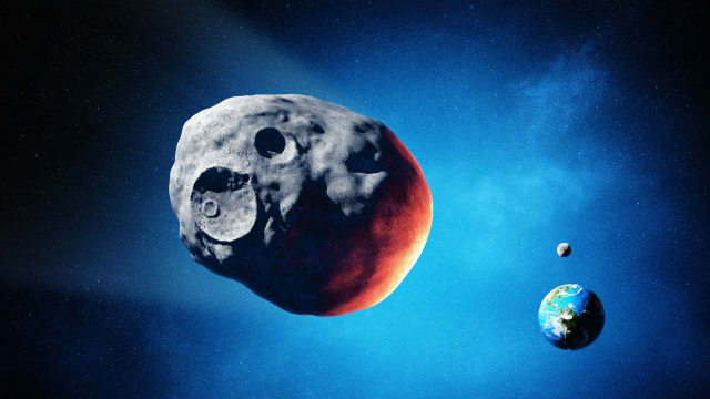 A photo including a Giant Asteroid and Planet Earth
