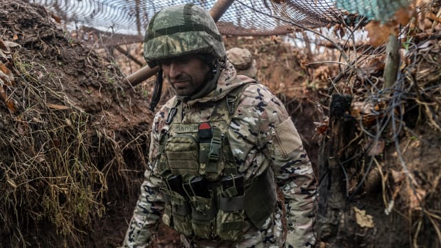 Ukrainian soldier is seen in his combat position in a trench in Niu York, Ukraine.