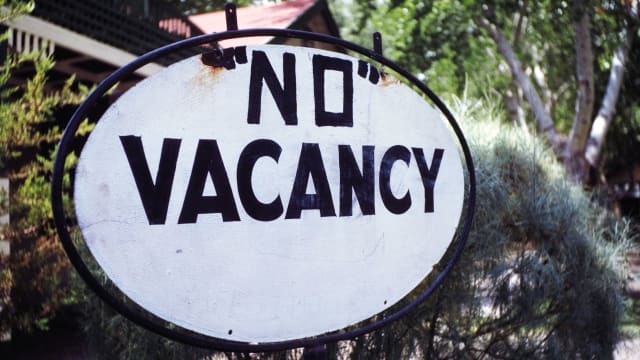 A photo including a No Vacancy sign 