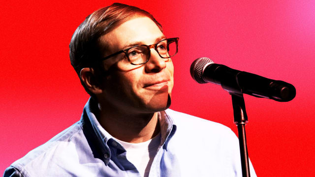 Photograph of Joe Pera on a pink and red background