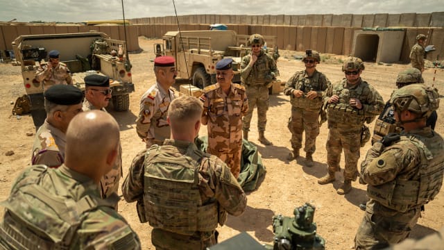 U.S. Army Soldiers assigned to Bravo Battery, 1st Battalion, 134th Field Artillery Regiment, 37th Infantry Brigade Combat Team, and Iraqi Army officer.