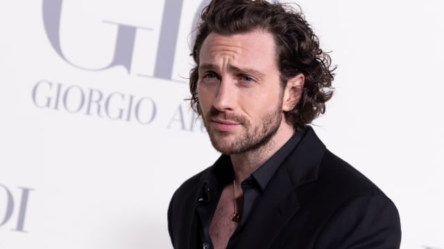 Aaron Taylor-Johnson on a red carpet.
