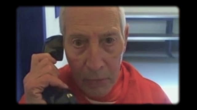 Robert Durst on a prison phone in a still from ‘The Jinx Part Two’