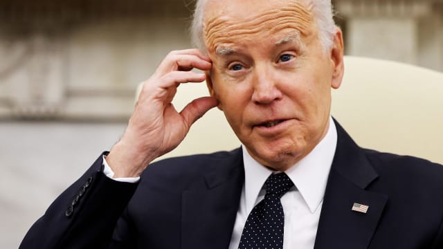 Joe Biden scratches his head in an interview.