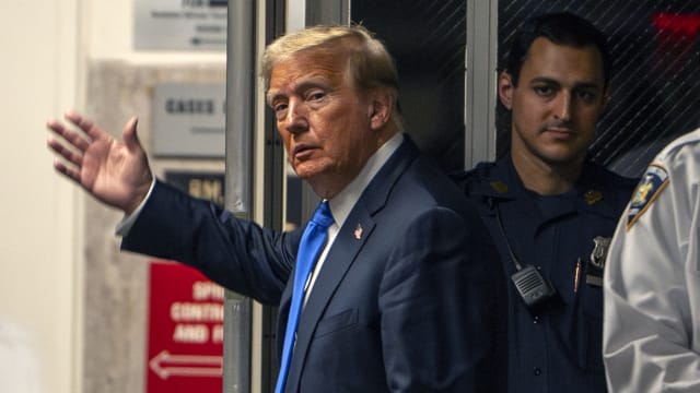 Former U.S. President Donald Trump gestures as he leaves court during his hush money trial at Manhattan Criminal Court on May 30, 2024 in New York City.