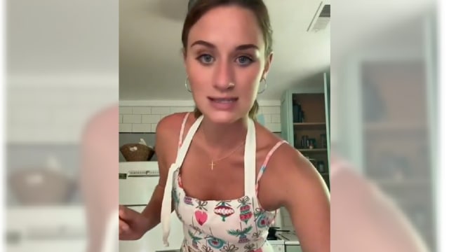 Lilly Gaddis speaks while wearing an apron in a TikTok video.
