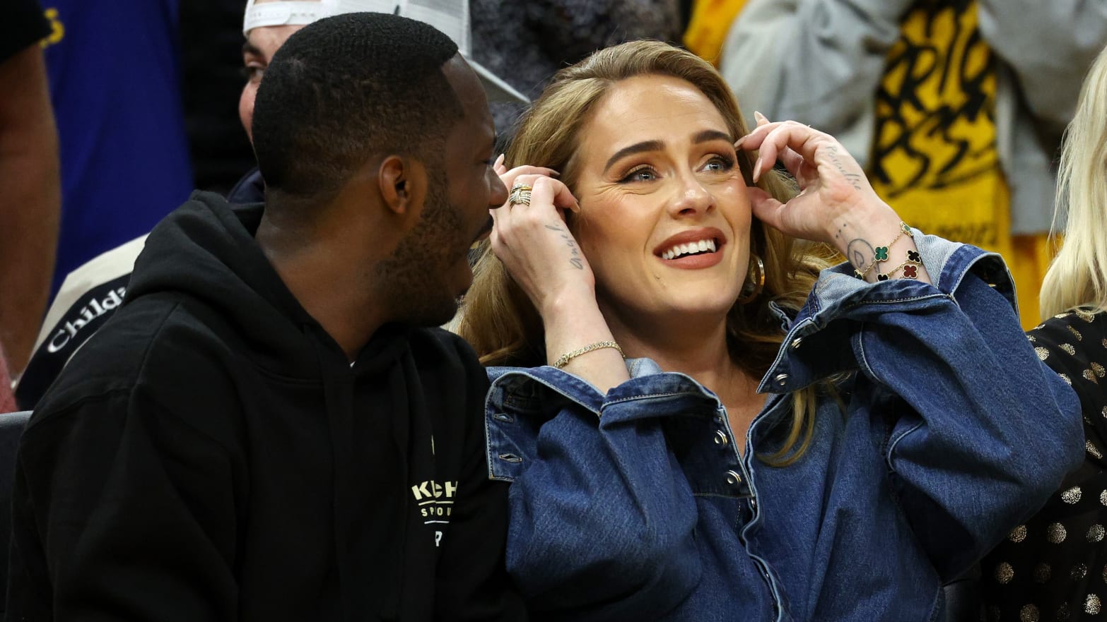 Adele and Rich Paul sit courtside at an NBA game
