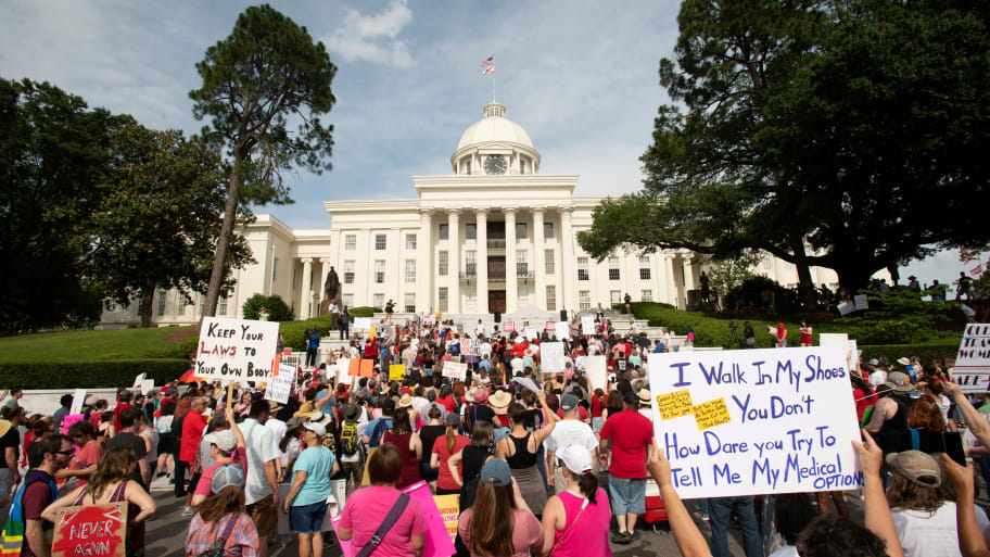 People listen at the Alabama State Capitol during the March for Reproductive Freedom against the Alabama Human Life Protection Act on May 19, 2019. 