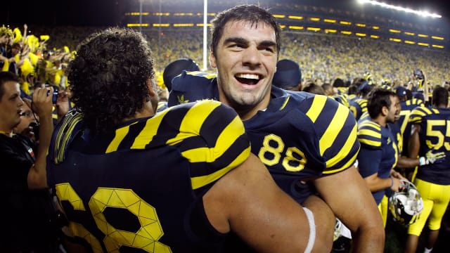 Craig Roh of the Michigan Wolverines celebrates a 35-31 over Notre Dame Fighting Irish in 2010