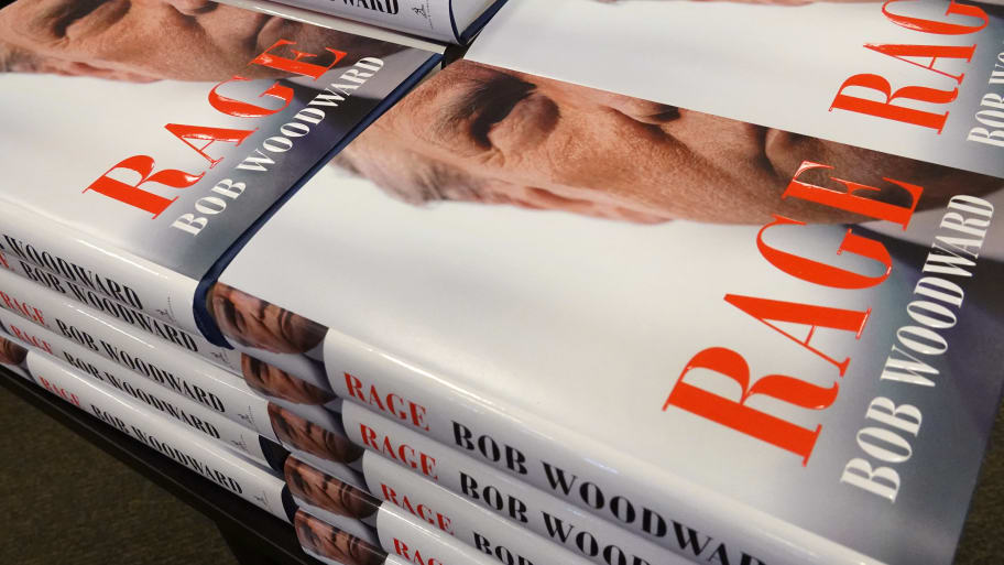 Copies of Bob Woodward’s 2020 book ‘Rage,’ featuring Donald J. Trump on the cover