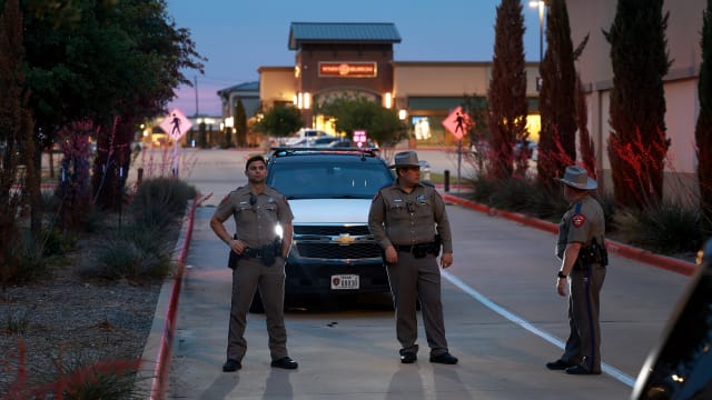 Texas Department of Public Safety officers block an entranceway to the Allen Premium Outlets mall May 7, 2023 in Allen, Texas.