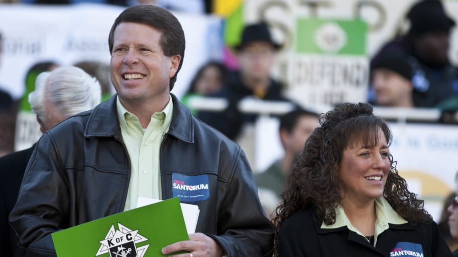 Jim Bob Duggar (L) and his wife Michelle Duggar (R), supporters of Republican presidential candidate and former Pennsylvania Senator Rick Santorum, attend a Pro-Life rally  in Columbia, South Carolina, on the steps of the State House January 14, 2012.