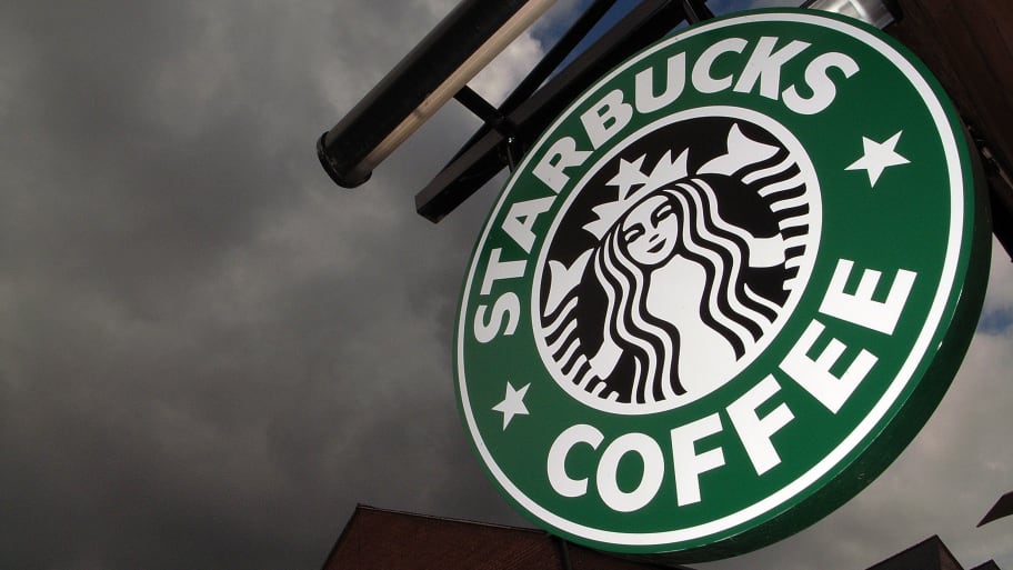 The Starbucks logo hangs outside one of the company's cafes in Northwich.