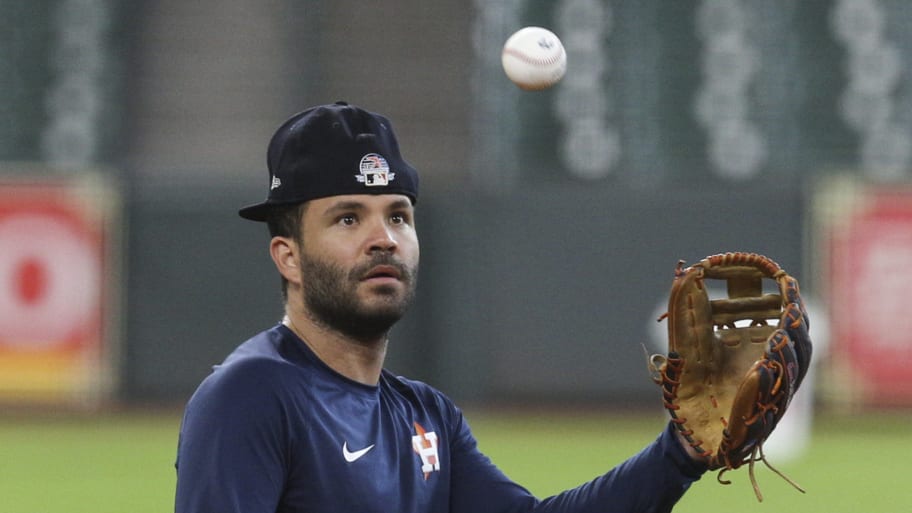 Houston Astros second baseman Jose Altuve (27) fields a ball during practice at Minute Maid Park.