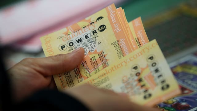A customer buys Powerball tickets at Kavanagh Liquors on January 13, 2016 in San Lorenzo, California