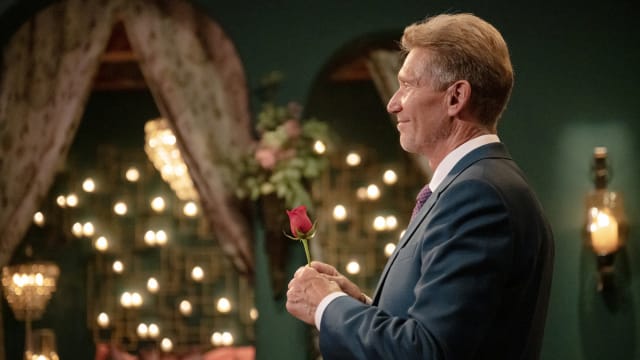 Photo still of Gerry Turner holding a rose in 'The Golden Bachelor'
