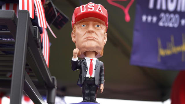 Vendors offer merchandise for sale at a rally with Donald Trump