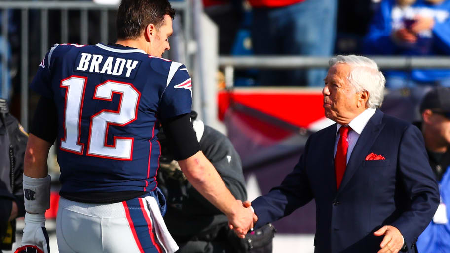 Tom Brady #12 shakes the hand of owner Robert Kraft of the New England Patriots before a game against the Miami Dolphins at Gillette Stadium on December 29, 2019 in Foxborough, Massachusetts. 